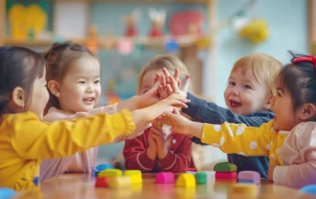 baby-friends-stacking-hands-together-happy-students-celebrating-together